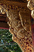 Wat Xieng Thong temple in Luang Prabang, Laos. the Ho Tai, the library. Detail of the console of the roof. 